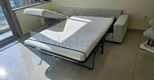 Light beige sofa bed with pull-out mattress  good condition