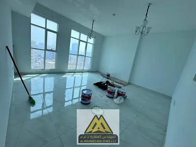 A two-bedroom apartment with a living room for annual rent in Ajman Corniche, featuring a beautiful