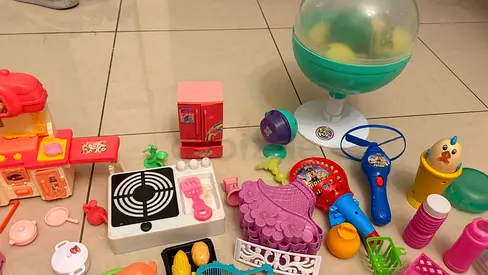Mixed girls' toy lot — dolls, play kitchen, tea set, pretend accessories