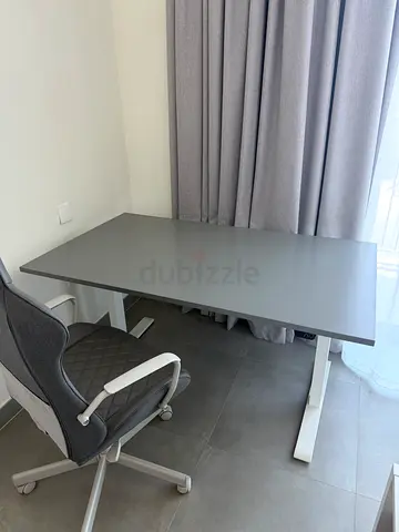 Ikea electric stand up desk with matching chair