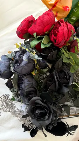 Artificial black and red rose bouquet — decorative faux flowers for Halloween