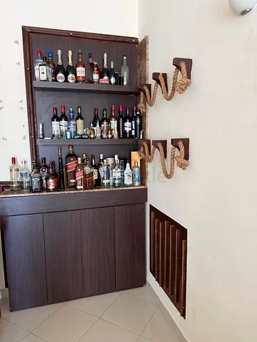 Urgent sell 🚨 Dark Wood Home Bar Cabinet with Open Shelves — Good Condition