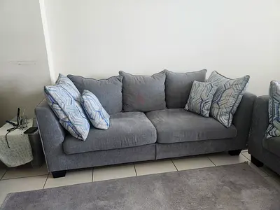 Grey 3-seater and 2-seater sofa set with cushions - good condition AED 600
