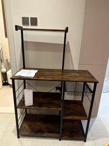 Industrial-style open wardrobe with shelves and hanging rail