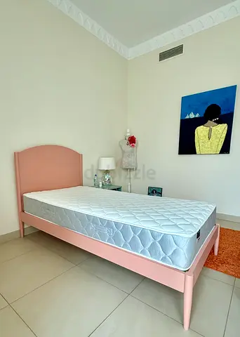 Single pink wooden bed frame