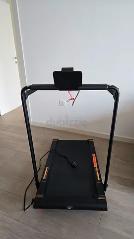 Compact electric treadmill with phone holder - used, good condition