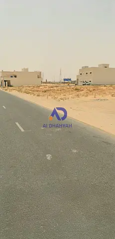 Commercial land for sale in Al-Houshi, great location, close to amenities, on two streets, front and back