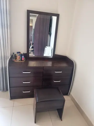 Dark wood dresser with mirror and matching stool - good condition