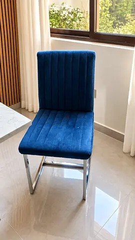 Modern marble-top dining table with 6 upholstered chairs