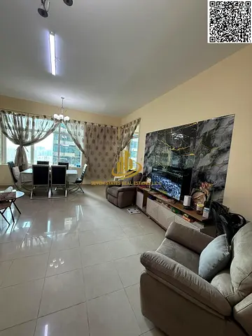 One-bedroom apartment with a living room at Horizon Towers, featuring a private parking space, a balcony, and a view.