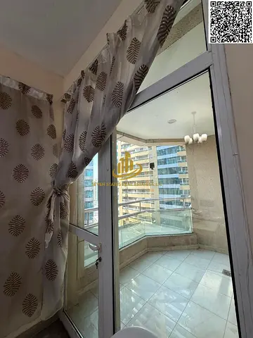One-bedroom apartment with a living room at Horizon Towers, featuring a private parking space, a balcony, and a view.