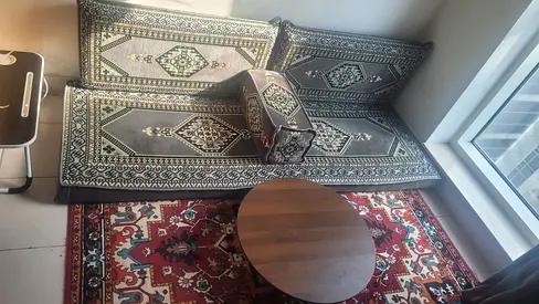 Traditional Middle Eastern floor seating set with rug and coffee table