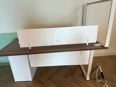 Varies office furniture with desks and chairs