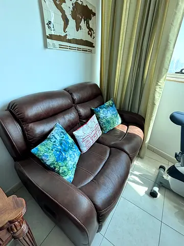 Two seat leather finish recliner
