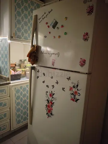 White Double-Door Refrigerator with Floral Decals - Good Working Condition