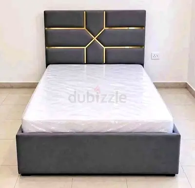 Single grey upholstered bed frame with geometric headboard (with mattress)