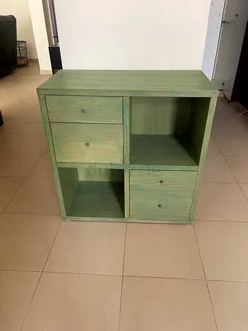 Light green wooden storage cabinet with 4 doors and 2 open shelves