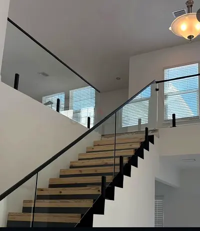 Modern floating wooden staircase with glass railing - sturdy and stylish