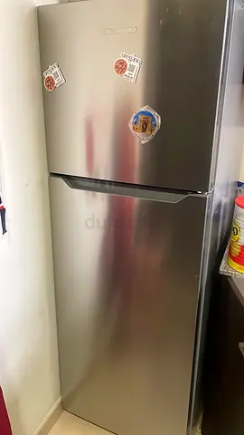 Silver double-door refrigerator - good working condition
