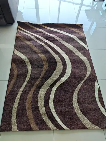 Brown wavy pattern area rug - good used condition