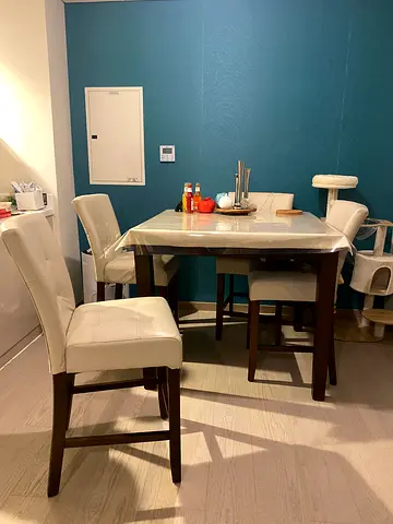 Square high dining table with 4 cream leather counter chairs - used