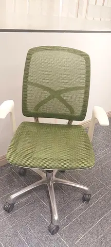 Green mesh ergonomic office chair with wheels