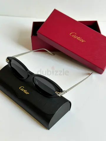 Cartier women's oval black sunglasses with case and box