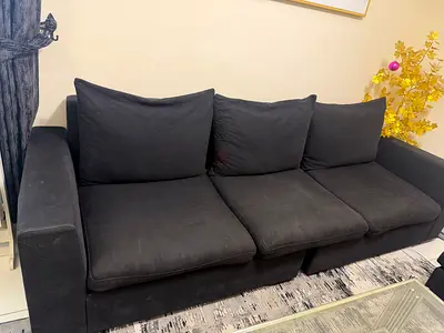 3-seater black fabric sofa in good condition