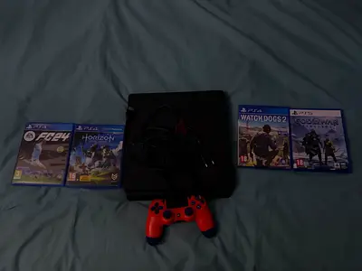 PS4 slim with all games in good condition, including wires and a functional controller.