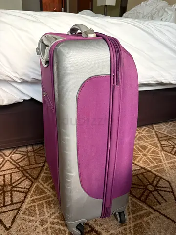 Purple soft-shell roller luggage suitcase with wheels. Size M. Very high quality brand.