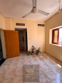 Studio for rent in Al Ghuwair, Sharjah, featuring a separate kitchen and central AC. Prime location 