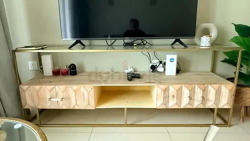 TV console/entertainment unit with geometric wooden drawers and metal frame