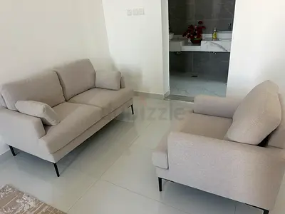 Light grey 2-seater sofa and matching armchair set - good condition