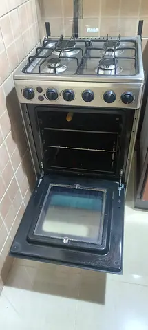 Cooking Range4-Burner Stainless Steel Gas Cooking Range with Oven – Good Working Condition