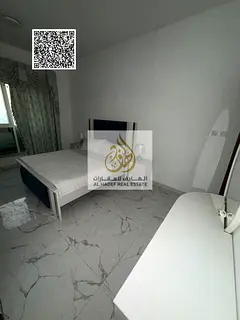 Furnished one-bedroom apartment with a living room for annual rent in Al Waha Towers; includes parki