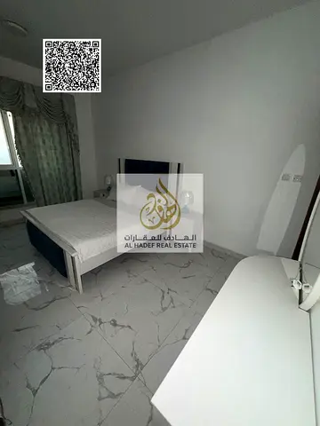 Furnished one-bedroom apartment with a living room for annual rent in Al Waha Towers; includes parking, a gym, and a swimming pool.