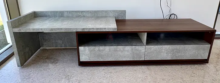Modern low-profile TV entertainment unit with concrete-look finish