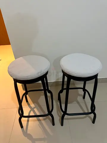 IKEA Pair of black metal bar stools with white cushions