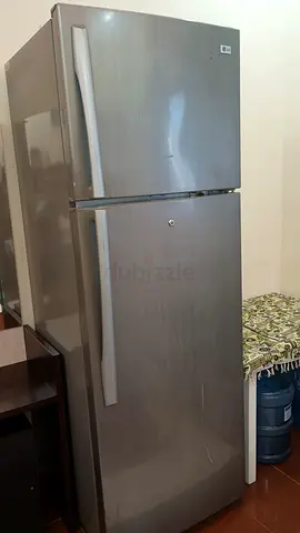 Good condition stainless steel fridge-freezer, top freezer, only compressor loading relay issue.