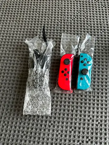 Pair of Neon Red & Blue Nintendo Switch Joy-Con Controllers (Used, perfect Condition)