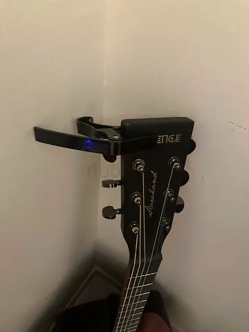 Acoustic guitar (Edge) with capo - good condition