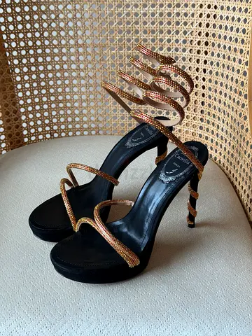 Black platform sandals with gold spiral crystal straps, size unknown