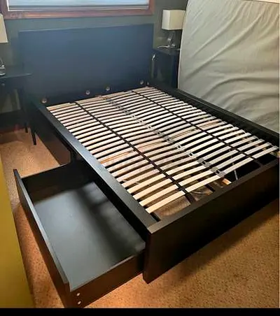 Black wooden double bed frame with storage drawer