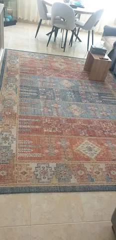 Large patterned area rug - warm tones, good condition