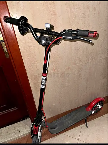 Used adult electric scooter with handbrake and suspension - good condition display broken