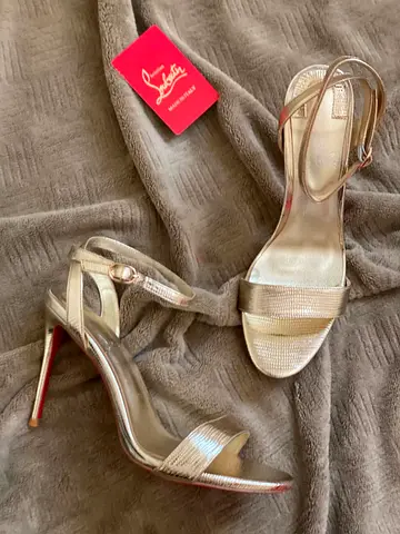 Christian Louboutin gold strappy heels - size not specified, gently used