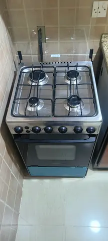 Cooking Range4-Burner Stainless Steel Gas Cooking Range with Oven – Good Working Condition