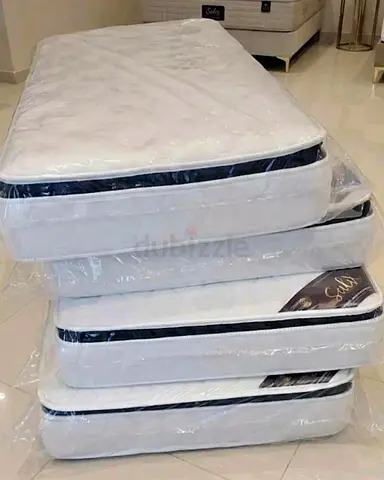 Stack of New Single Mattresses (Still Wrapped) brand new