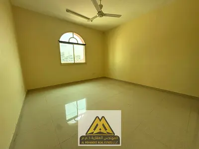 A practical 2-bedroom apartment in Al Rawda 2, Ajman, featuring a master bedroom, two bathrooms, sp