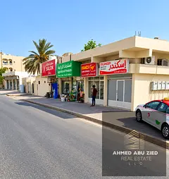A residential and commercial house on a corner of two streets with an annual income of 148,000 AED.